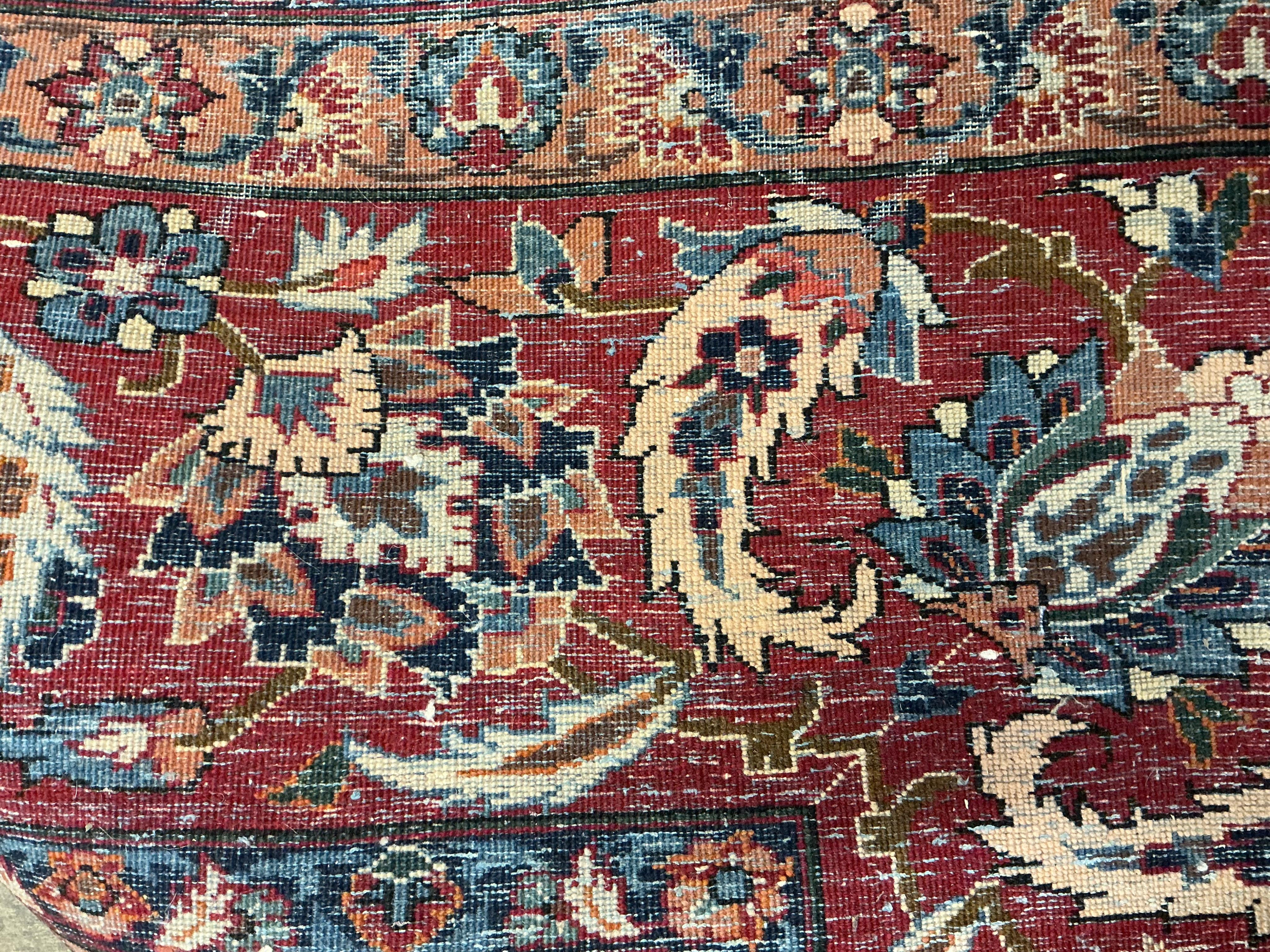 A North West Persian ivory ground floral carpet, 350 x 254cm
